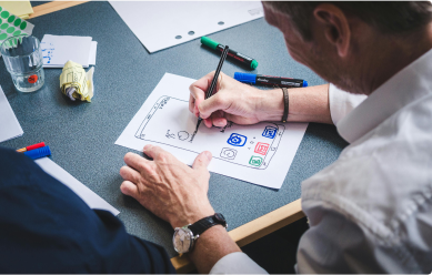 A person working on a paper prototype design